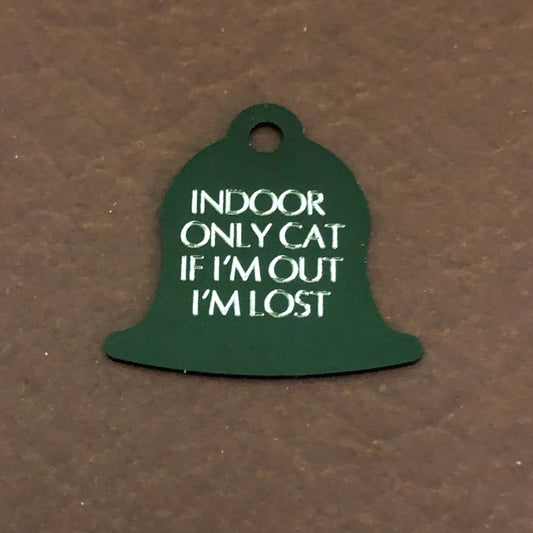 Small green bell tag that says: Indoor only cat If I'm out I'm lost. All engraved in capital letters.
