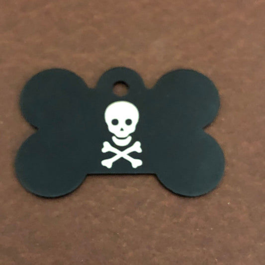 It is a large black bone aluminum tag with a skull and bones on it.
The Tag measures approximately 1 9/16"W x 1 1/16"H.