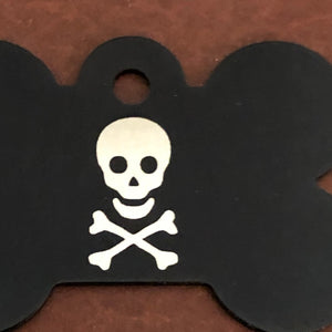 A close up of a large black bone aluminum tag with a skull and bones on it. The Tag measures approximately 1 9/16&quot;W x 1 1/16&quot;H.